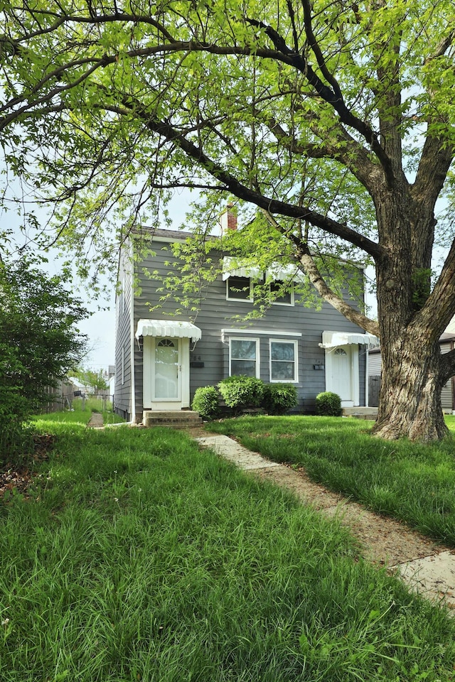784 E Mithoff St, Columbus, OH 43206 - view of front facade with a chimney
