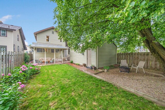 297 E Welch Ave, Columbus, OH 43207 - rear view of property with a fire pit and a patio area