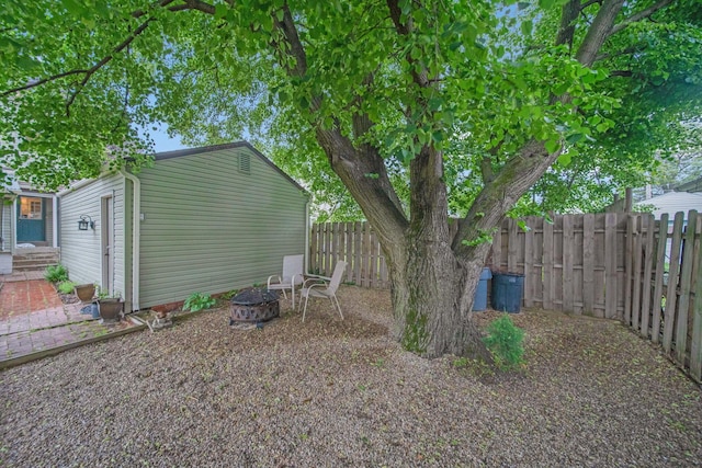 297 E Welch Ave, Columbus, OH 43207 - fenced backyard featuring a fire pit