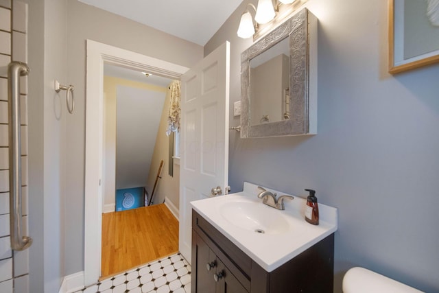 297 E Welch Ave, Columbus, OH 43207 - half bath with toilet, vanity, and tile patterned floors