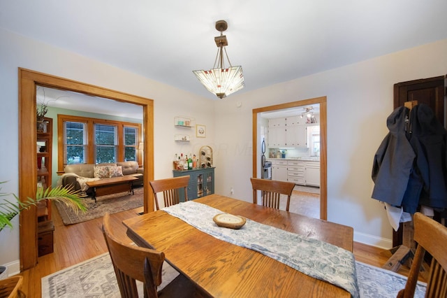 297 E Welch Ave, Columbus, OH 43207 - dining space featuring light wood-type flooring and baseboards