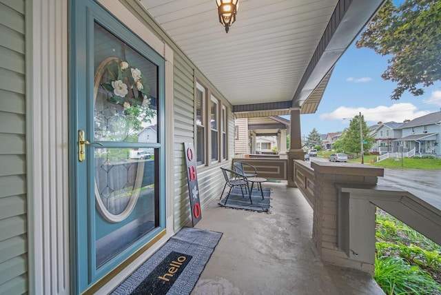 297 E Welch Ave, Columbus, OH 43207 - view of exterior entry featuring covered porch and a residential view