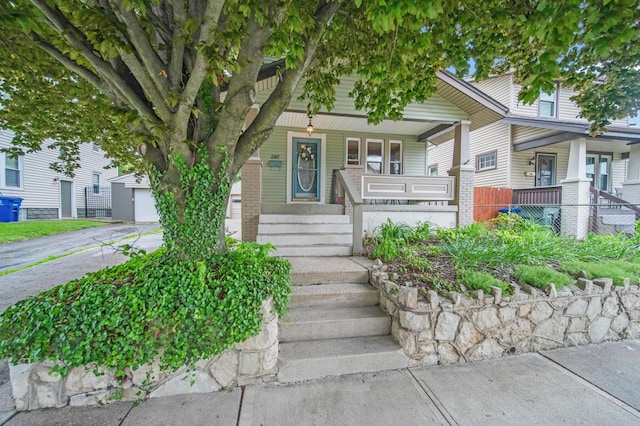 297 E Welch Ave, Columbus, OH 43207 - view of front of home with covered porch and brick siding