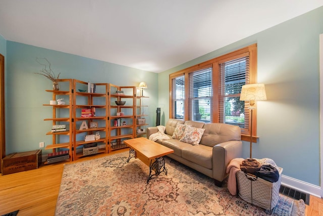 297 E Welch Ave, Columbus, OH 43207 - living room featuring wood finished floors and baseboards