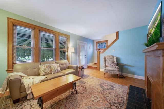 297 E Welch Ave, Columbus, OH 43207 - living room with baseboards and wood finished floors