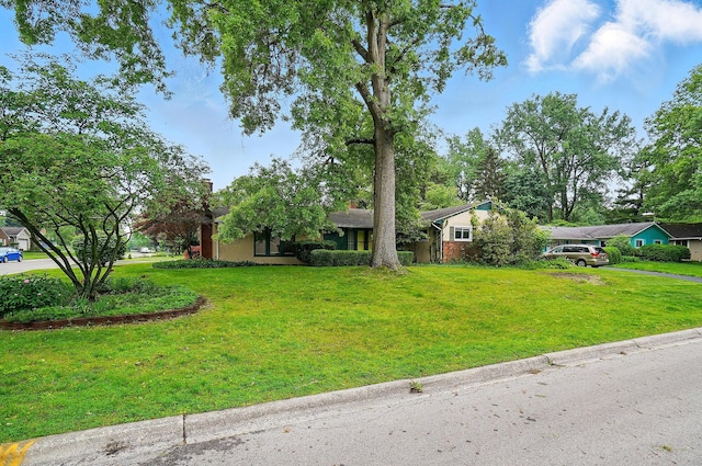 1120 Morning St, Worthington, OH 43085 - view of front of home featuring a front yard and a chimney