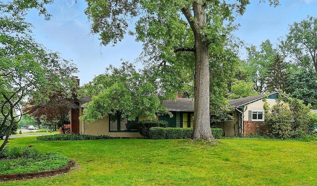 1120 Morning St, Worthington, OH 43085 - view of front of house featuring a front yard and a chimney