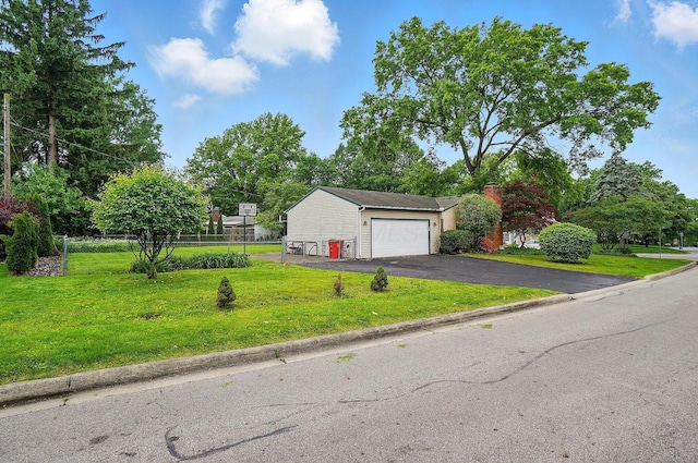 1120 Morning St, Worthington, OH 43085 - view of front facade with driveway, an attached garage, and a chimney