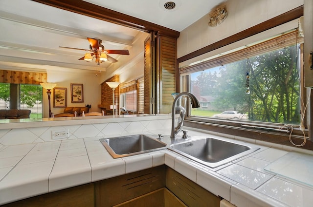 1120 Morning St, Worthington, OH 43085 - kitchen featuring tile countertops, healthy amount of natural light, ceiling fan, and a sink