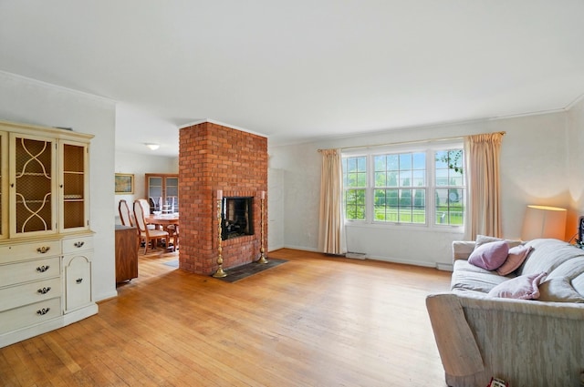 1120 Morning St, Worthington, OH 43085 - living area with light wood-style floors and a fireplace