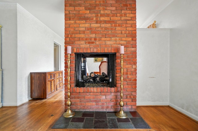 1120 Morning St, Worthington, OH 43085 - detailed view of wood finished floors, baseboards, and a brick fireplace