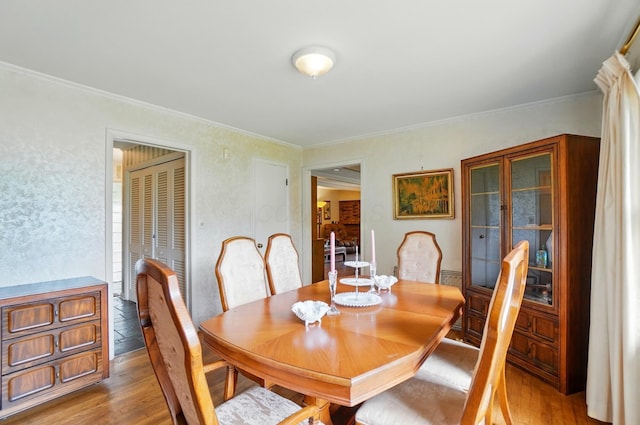 1120 Morning St, Worthington, OH 43085 - dining space featuring light wood-type flooring and ornamental molding