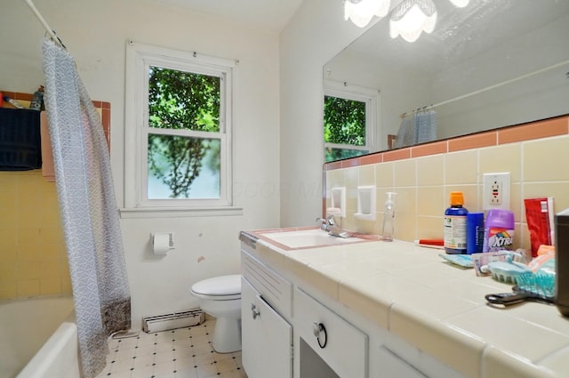 1120 Morning St, Worthington, OH 43085 - bathroom featuring baseboard heating, healthy amount of natural light, toilet, and vanity