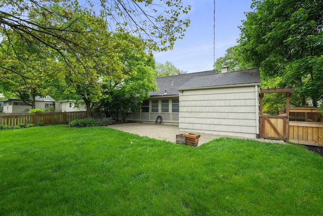 2314 Woodstock Rd, Columbus, OH 43221 - back of house featuring a patio, roof with shingles, a gate, and a chimney
