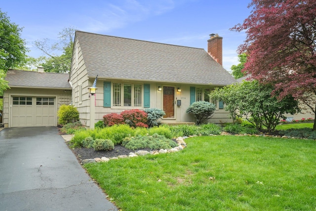 2314 Woodstock Rd, Columbus, OH 43221 - new england style home with a chimney, roof with shingles, driveway, and a front lawn