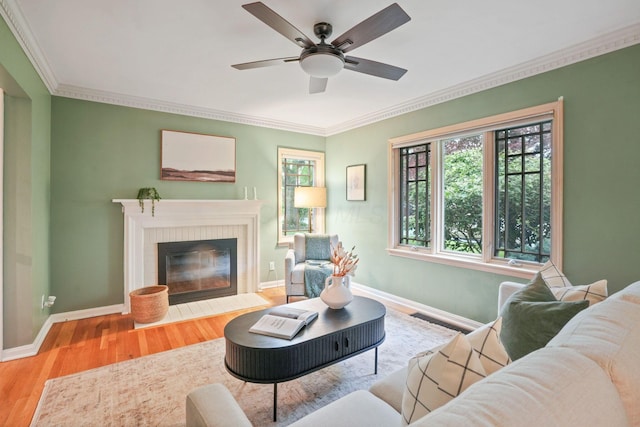 2314 Woodstock Rd, Columbus, OH 43221 - living area with wood finished floors, ornamental molding, baseboards, ceiling fan, and a fireplace