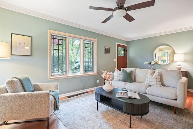 2314 Woodstock Rd, Columbus, OH 43221 - living area with wood finished floors, ornamental molding, ceiling fan, and baseboards