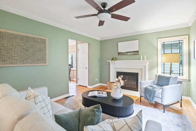 2314 Woodstock Rd, Columbus, OH 43221 - living room with plenty of natural light, ornamental molding, wood finished floors, baseboards, and a brick fireplace