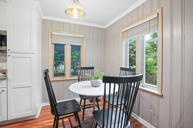2314 Woodstock Rd, Columbus, OH 43221 - dining area with ornamental molding, baseboards, and wood finished floors