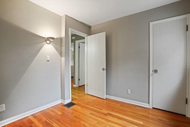 2314 Woodstock Rd, Columbus, OH 43221 - unfurnished bedroom featuring light wood-style flooring and baseboards