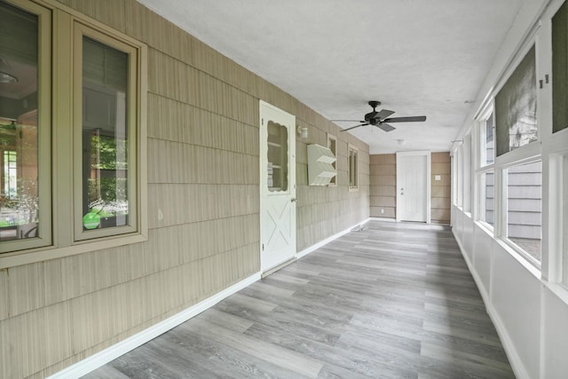 2314 Woodstock Rd, Columbus, OH 43221 - unfurnished sunroom featuring a ceiling fan