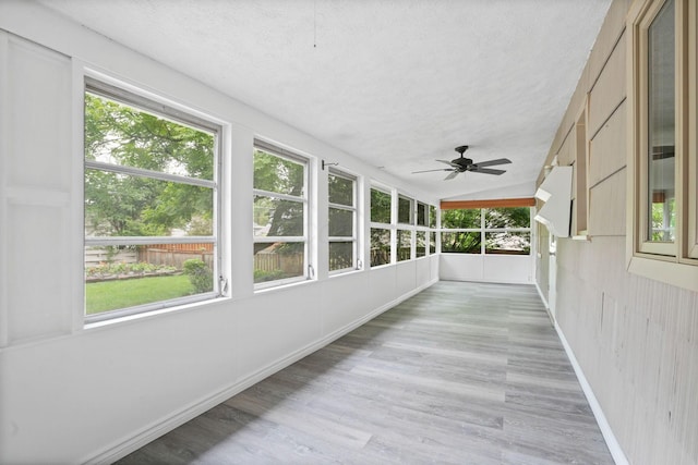 2314 Woodstock Rd, Columbus, OH 43221 - unfurnished sunroom featuring plenty of natural light, wood finished floors, a textured ceiling, ceiling fan, and lofted ceiling