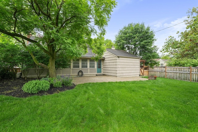 2314 Woodstock Rd, Columbus, OH 43221 - rear view of house featuring a patio area and roof with shingles