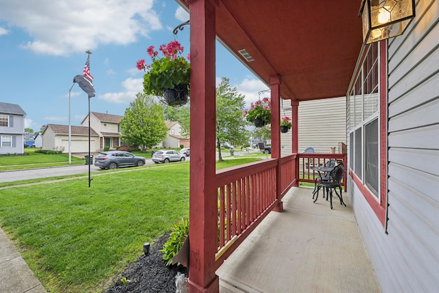 5046 Rolling Rock Ct, Columbus, OH 43229 - covered porch featuring a lawn and a residential view