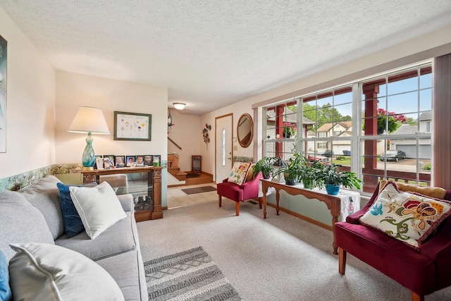 5046 Rolling Rock Ct, Columbus, OH 43229 - carpeted living room featuring stairs and a textured ceiling