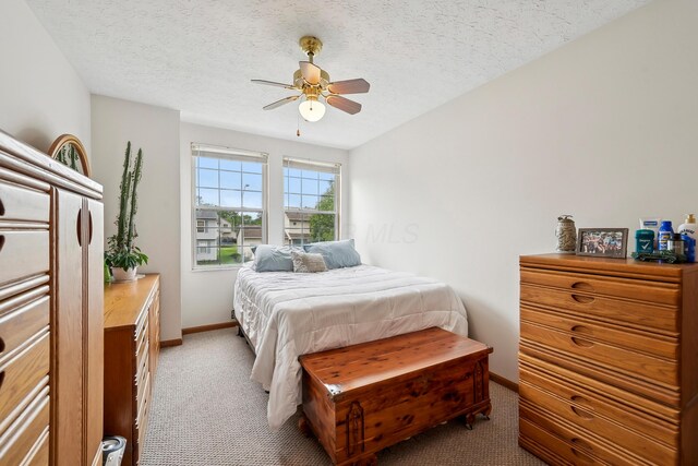 5046 Rolling Rock Ct, Columbus, OH 43229 - bedroom featuring light colored carpet, baseboards, a textured ceiling, and ceiling fan