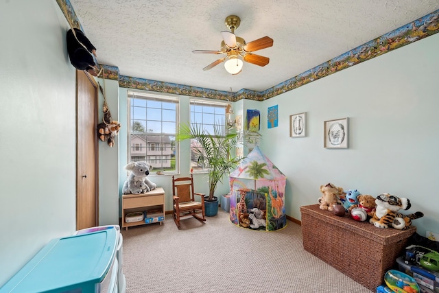 5046 Rolling Rock Ct, Columbus, OH 43229 - game room featuring a textured ceiling, carpet, and a ceiling fan