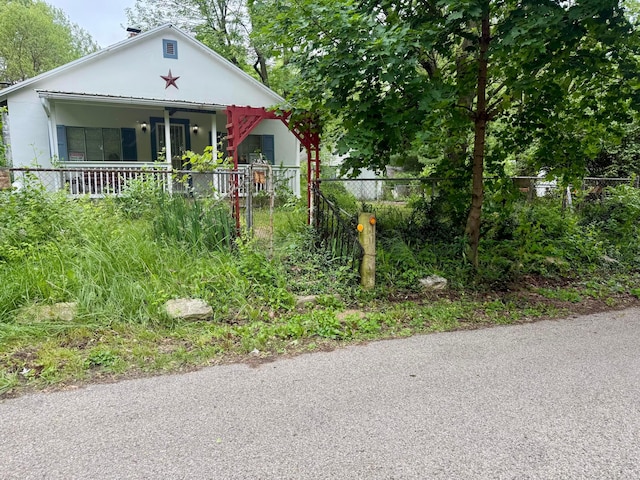 19 University Rd, Medway, OH 45341 - bungalow-style home featuring a porch and stucco siding