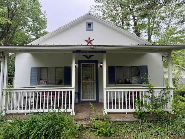 19 University Rd, Medway, OH 45341 - view of front of house featuring covered porch and metal roof