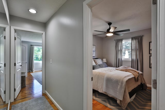7775 Pembrook Dr, Reynoldsburg, OH 43068 - bedroom featuring baseboards, light wood-type flooring, and a ceiling fan