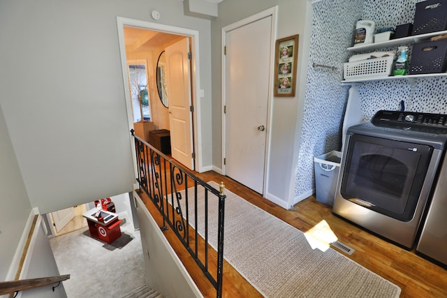 7775 Pembrook Dr, Reynoldsburg, OH 43068 - washroom with wood finished floors, baseboards, and washer and clothes dryer