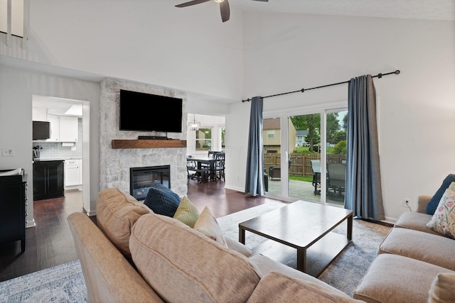 336 Saint Thomas Dr, Westerville, OH 43081 - living area with a ceiling fan, dark wood-type flooring, high vaulted ceiling, plenty of natural light, and a fireplace