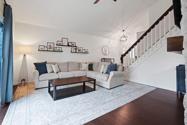 336 Saint Thomas Dr, Westerville, OH 43081 - living room with stairway, dark wood-type flooring, ceiling fan, and baseboards