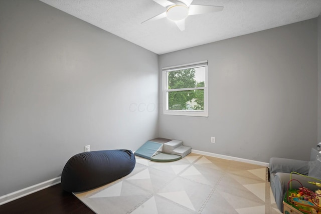 336 Saint Thomas Dr, Westerville, OH 43081 - sitting room with ceiling fan, baseboards, and a textured ceiling