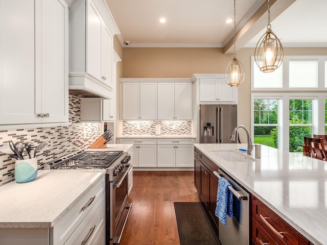 11465 Canby Ct, Plain City, OH 43064 - kitchen with appliances with stainless steel finishes, a sink, crown molding, wood finished floors, and backsplash