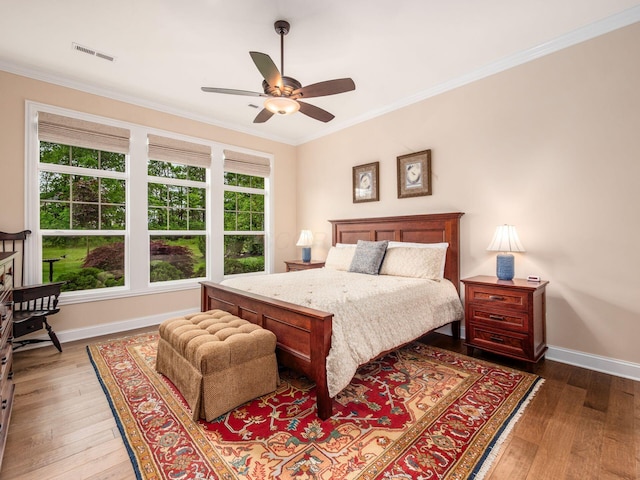 11465 Canby Ct, Plain City, OH 43064 - bedroom with crown molding, wood finished floors, baseboards, and a ceiling fan