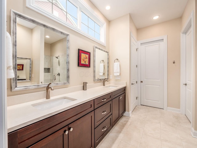 11465 Canby Ct, Plain City, OH 43064 - bathroom featuring tiled shower, double vanity, baseboards, tile patterned floors, and recessed lighting