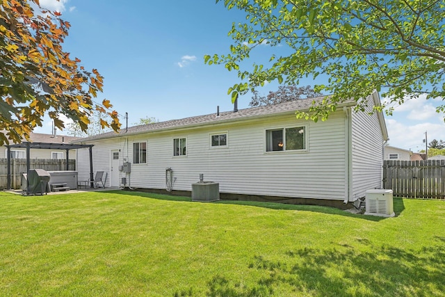268 Southwood Rd, West Jefferson, OH 43162 - rear view of house featuring a hot tub and central air condition unit