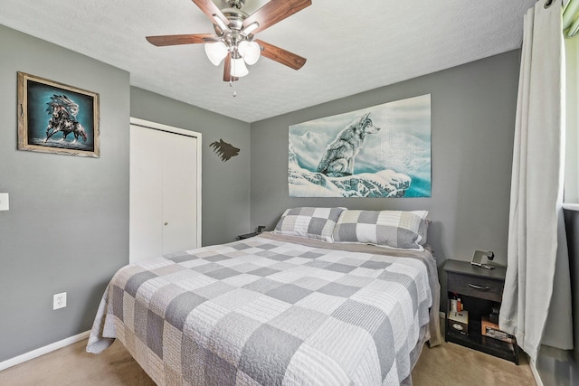 268 Southwood Rd, West Jefferson, OH 43162 - carpeted bedroom with baseboards, a textured ceiling, a ceiling fan, and a closet