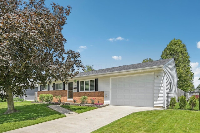 268 Southwood Rd, West Jefferson, OH 43162 - single story home with driveway, a garage, and brick siding