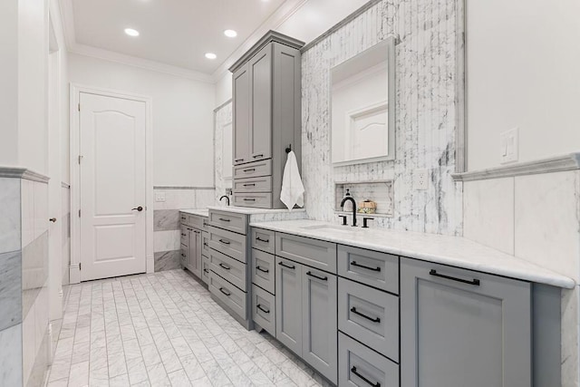 2989 Old Path Rd, Blacklick, OH 43004 - bathroom with double vanity, ornamental molding, tile walls, a wainscoted wall, and recessed lighting