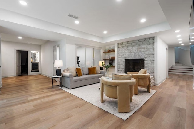 2989 Old Path Rd, Blacklick, OH 43004 - living area with stairs, baseboards, light wood-type flooring, a tray ceiling, and recessed lighting