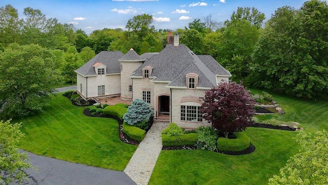2989 Old Path Rd, Blacklick, OH 43004 - french country style house featuring stone siding, a front yard, and a chimney