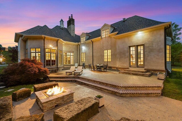 2989 Old Path Rd, Blacklick, OH 43004 - rear view of house with french doors, a fire pit, a chimney, a patio, and stucco siding