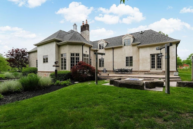 2989 Old Path Rd, Blacklick, OH 43004 - back of house with stucco siding, a patio area, a chimney, and a yard