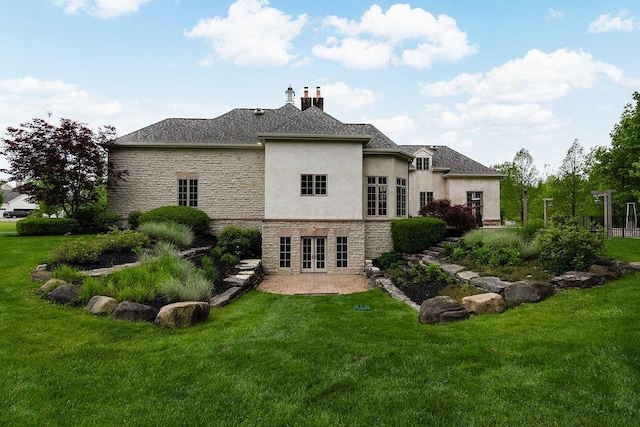 2989 Old Path Rd, Blacklick, OH 43004 - rear view of house with french doors, stone siding, a yard, and stucco siding